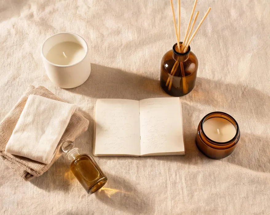 Home fragrance mood board with candles, diffusers, textiles and notes